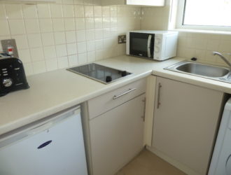 First floor studio apartment with balcony on outskirts of town